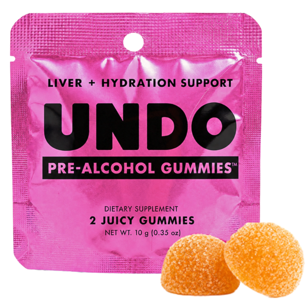 Pink pouch labeled 'UNDO Pre-Alcohol Gummies' with two orange gummies shown.